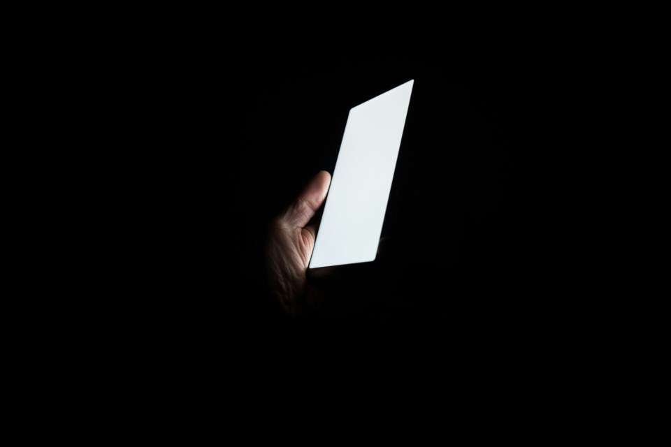 blank-smartphone-against-black-backdrop