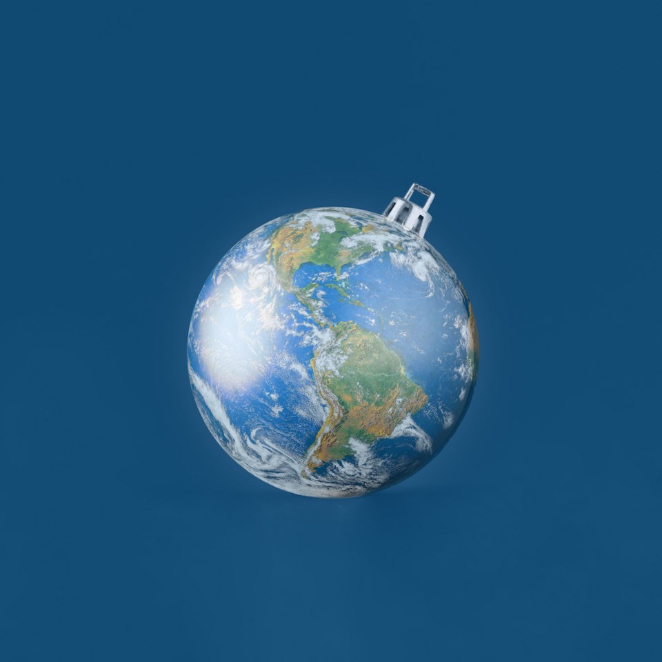 christmas-tree-ornament-ball-made-of-planet-earth-against-isolated-dark-blue-background