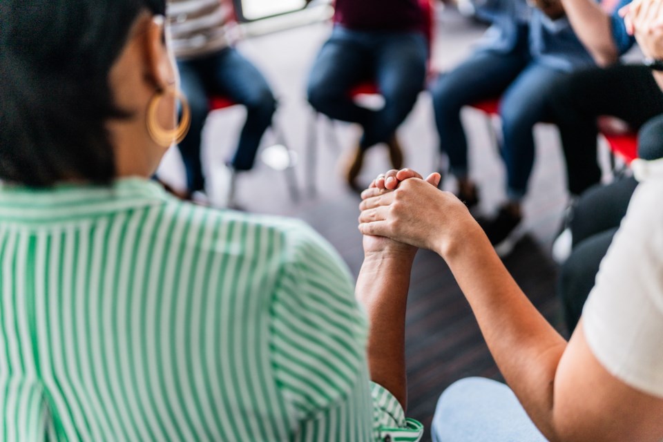 close-up-of-people-with-holding-hands-in-a-group-therapy