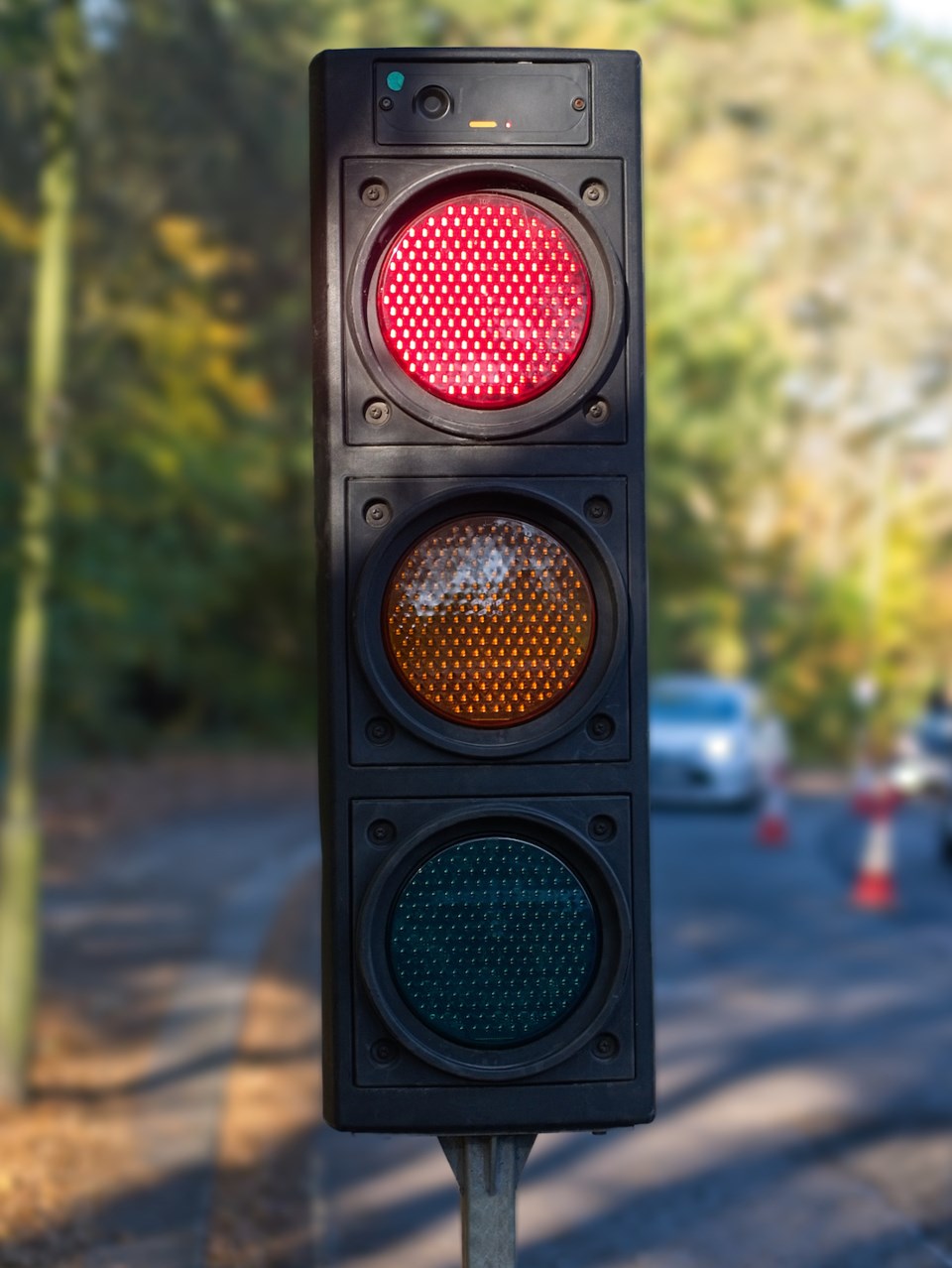 Close-up of temporary portable traffic signal for road works.