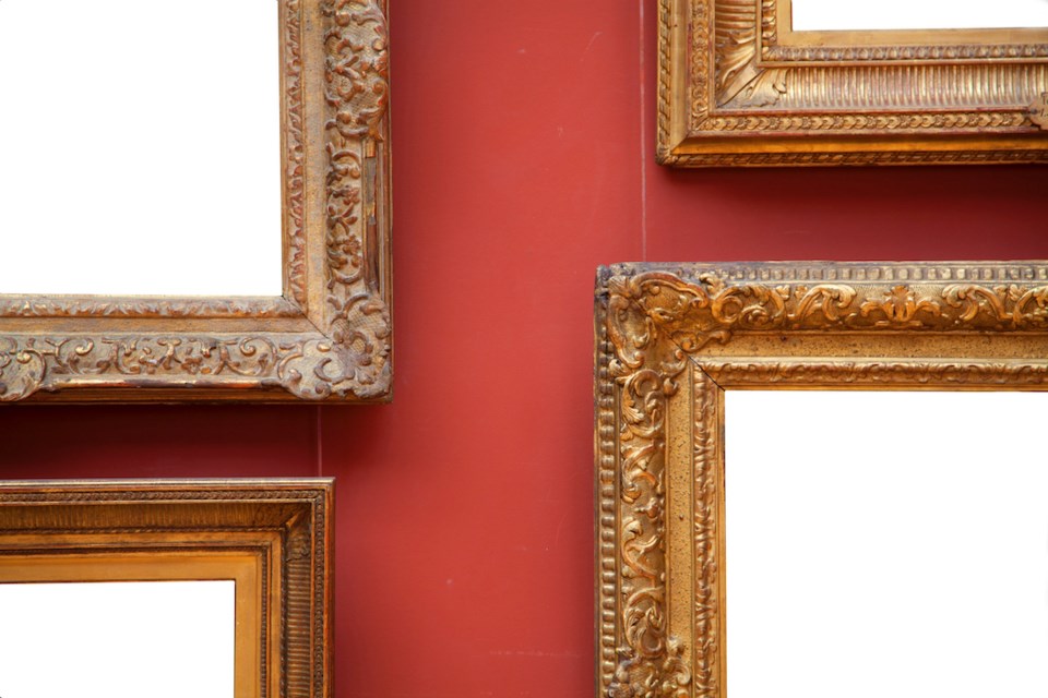 France, Paris, blank frames in salon hanging style.