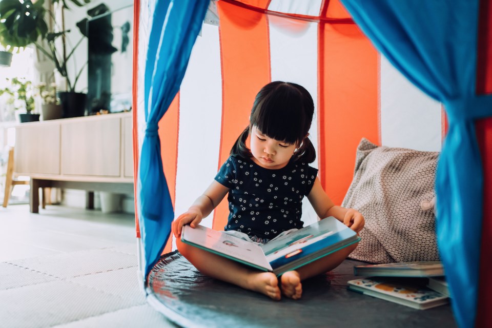 Girl reading a storybook