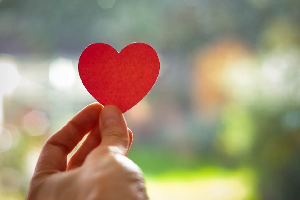 Paper heart in a hand