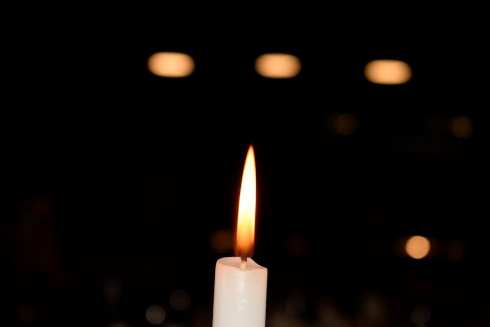 The flame of a candle with black background