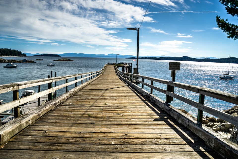 View to the sea from Halfmoon Bay wooden  harbour, Sunshine cost, British Columbia