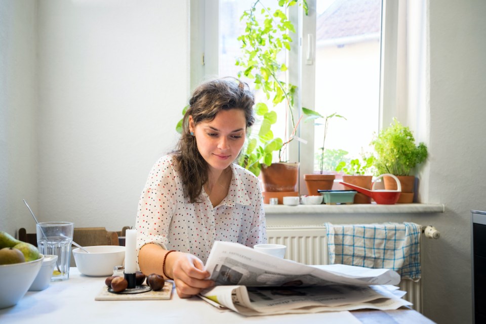 Woman reading a newspaper