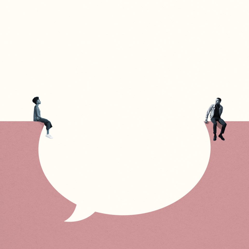 Young man and woman sitting around large blank thought bubble against white background