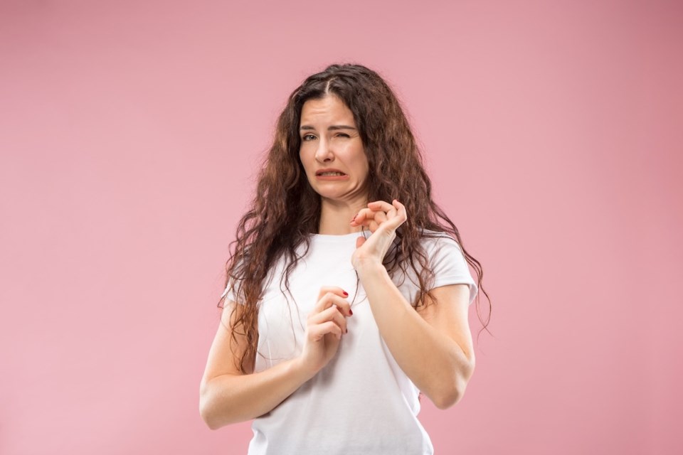 young-woman-with-disgusted-expression-repulsing-something
