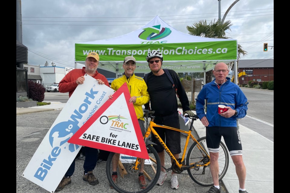 (Left to Right) Transportation Choices - Sunshine Coast (TraC) board members Mark Lebbell and Stephen Forgacs, along with Go By Bike Week participants Keith Donkersoot and Bruce Stewart, at the May 31 cycling “celebration station” at the intersection of Highway 101, Wharf and Dolphin.