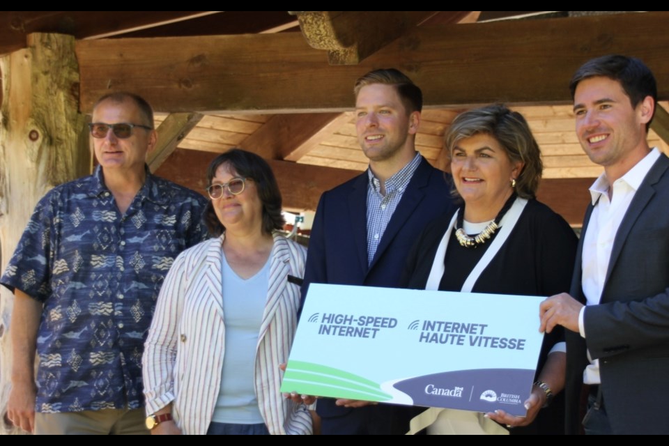 SCRD director Mark Hiltz, Kate-Louise Stamford of Islands Trust, CityWest's Scott Simpson, Minister Gudie Hutchings and MP Patrick Weiler at the Sept. 6 announcement on Gambier Island. 