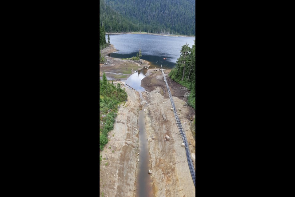 Siphons draw water from Chapman Lake on Friday, Aug. 27. 