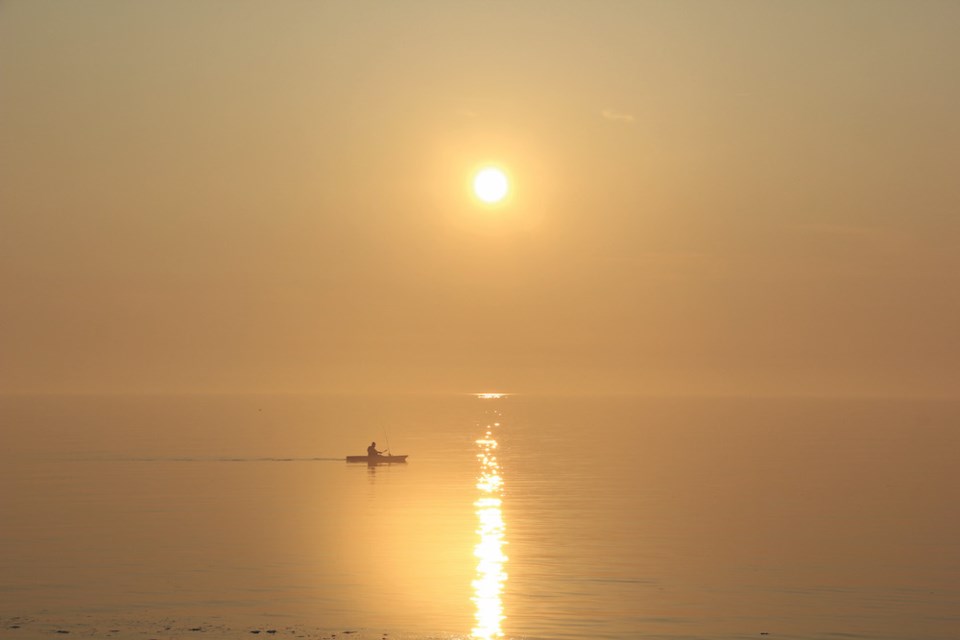 a-kayaker-in-hazy-sunlight