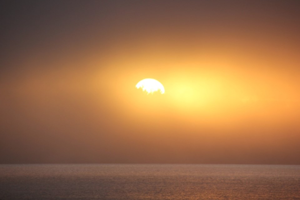 A fog advisory lifted on Nov. 27, but fog lingered over the Trail Islands at sunset.