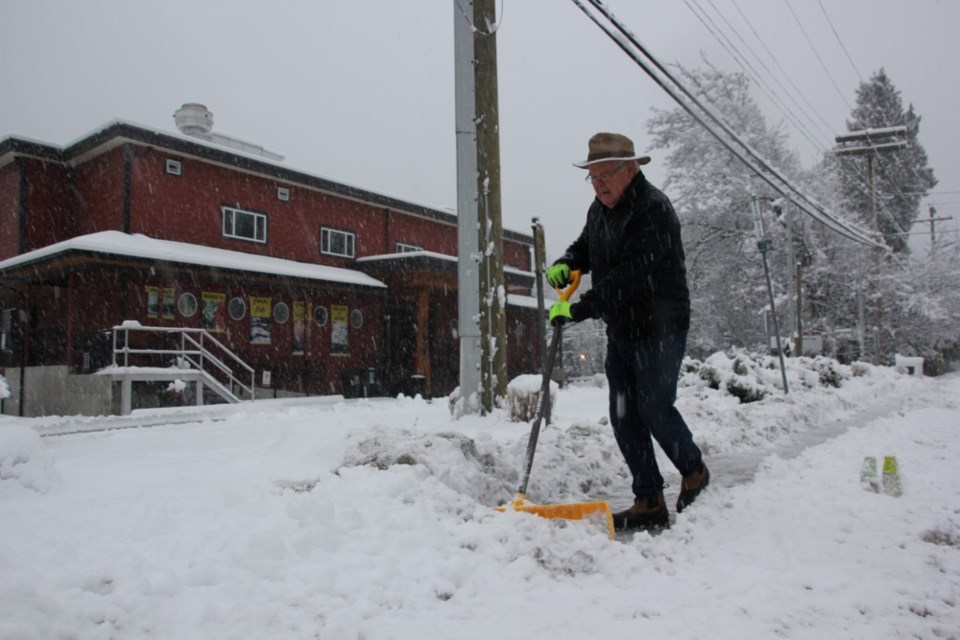 Volunteer Pete McDonald dedicated his morning to clearing the sidewalk in front of Gibsons Public Market on Jan. 17 (and hopes to inspire others to clear the snow -- and volunteer locally).