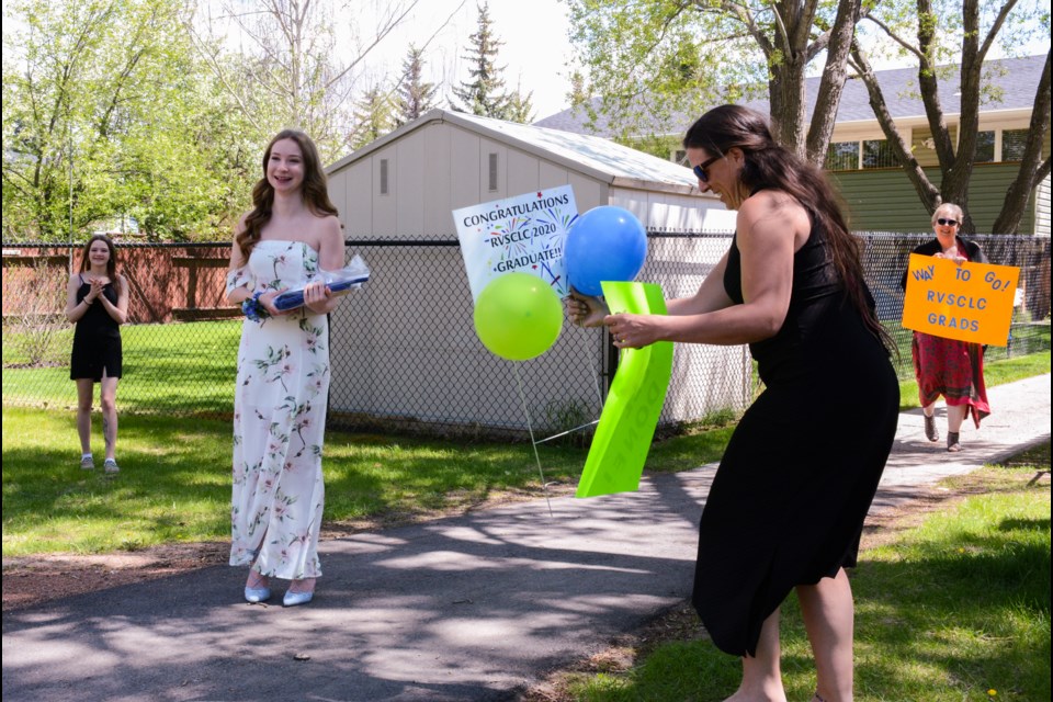 Cochrane Learning Centre graduate Emery Newton receives her diploma on Wednesday (June 3). (Chrissy da Silva/The Cochrane Eagle)