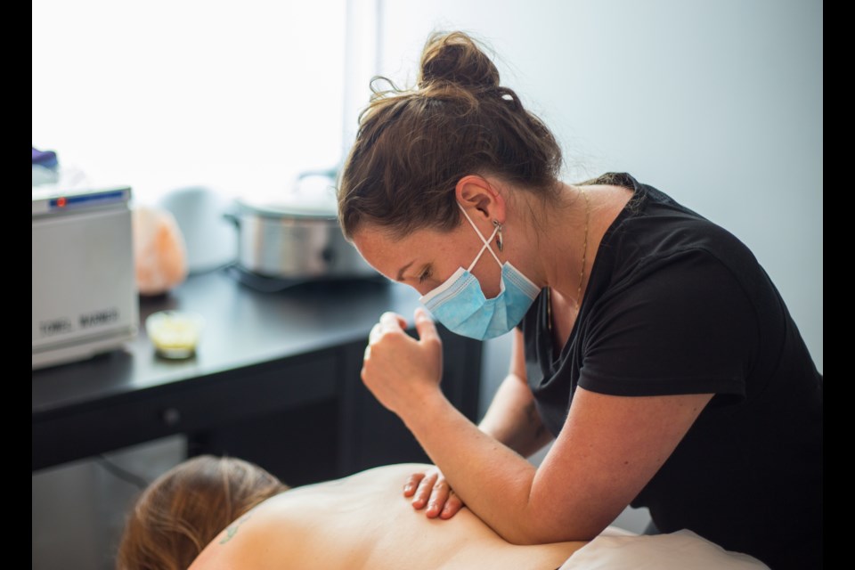 Salt Water Wellness Centre co-owner Sarah d’Abadie provides a massage to a client on Monday (June 22). The date marked the first time the centre has been opened since it closed due to COVID-19 in March. (Chelsea Kemp/The Cochrane Eagle)