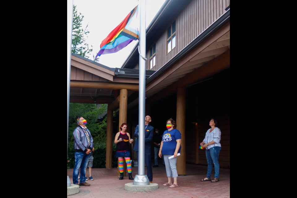 Cochrane Mayor Jeff Genung hoists the Progress Pride Flag marking the start of the Townâs first-ever Pride Week on Monday (Aug. 17).(Chelsea Kemp/The Cochrane Eagle)
