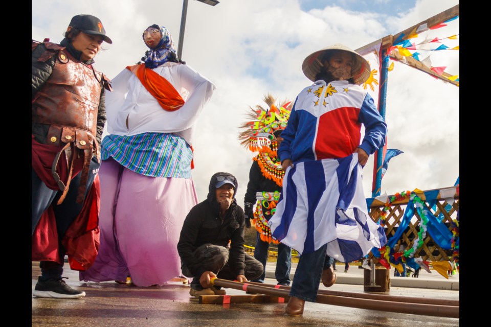 Eileen Lazo performs the national Philippine Tinikling dance at the Filipino Canadian Association of Cochrane Alberta float at the 2020 Labour Day Parade (Display) on Sept. 7, 2020. (Chelsea Kemp/The Cochrane Eagle)