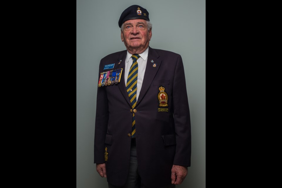 Royal Canadian Air Force veteran John Ferguson poses for a photoat the Cochrane Legion on Tuesday (Oct. 27). (Chelsea Kemp/The Cochrane Eagle)
