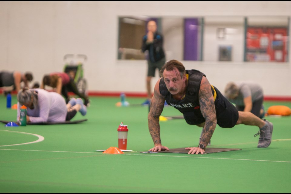 Det. Paul Wagman works out at the Sweat For a Vet event at the Spray Lake Sawmills Family Sports Centre on Monday (Oct. 9). The fundraising event was in support of the Wayfinders Wellness Retreatâ A local group that supports first responders and veterans healing from PTSD. During Sweat For a Vet guests had two ways to work out, they could participate in the Military Boot Camp or the March/Walk for Freedom along the Bow River. (Chelsea Kemp/The Cochrane Eagle)