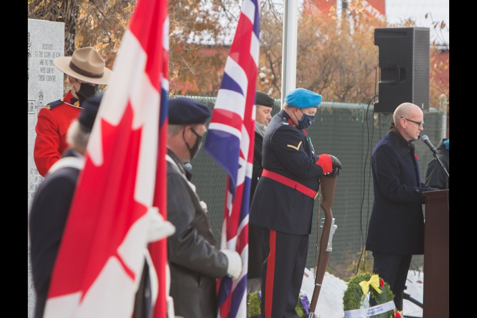 Mayor Jeff Genung speaks at the Remembrance Day Ceremony at the Cochrane Cenotaph on Wednesday (Nov. 11). To comply with COVID-19 public health measures the Cenotaph grounds were cordoned off, with seating reserved for invited guests and veterans. The day was made all the more important as it marked the 75th anniversary of the end of the Second World War. (Chelsea Kemp/The Cochrane Eagle)