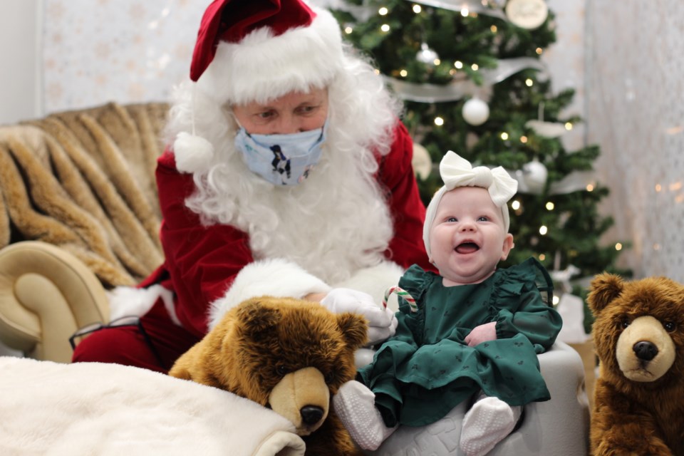 Four Cubs, Cochrane's newest children's store, is donating proceeds from Santa visits to Helping Families Handle Cancer. 