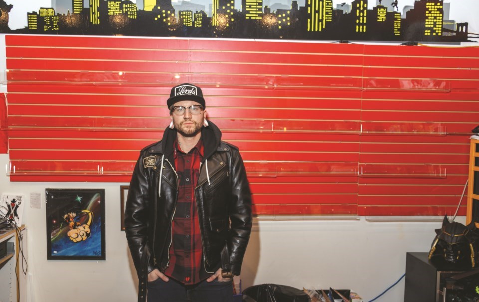 Rebel Comics owner Devin Petitclerc stands in front of shelves emptied by thieves on Sunday (Feb. 28). Petitclerc estimated $10,000 to $17,000 in goods was stolen from the store. (Chelsea Kemp/The Cochrane Eagle)