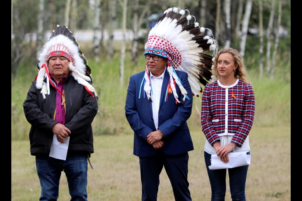 Stoney Nakoda Chiefs Clifford Poucette of the Wesley band, left, and Aaron Young of the Chiniki band and Banff-Kananaskis MLA Miranda Rosin at the renaming of a mountain ceremony in Canmore on Aug. 23. (Jordan Small/RMO)