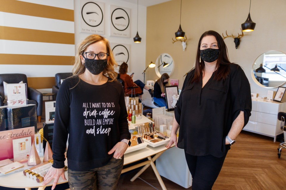 Flirt Cosmetics Studio and Brow Bar owners Sheri Meyer, left, and Ciara Ramsden welcome guests to their shop on Monday (Jan. 18). (Chelsea Kemp/The Cochrane Eagle)