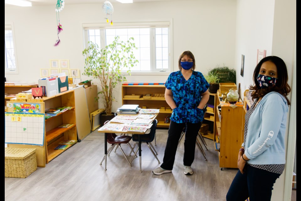 Angel Wings Daycare and Montessori Preschool assistant program supervisor and director of Montessori studies Jocelyn Taylor, left, and owner Divya Hebbic show off the learning space at the centre on Tuesday, March 2, 2021. (Chelsea Kemp/The Cochrane Eagle)