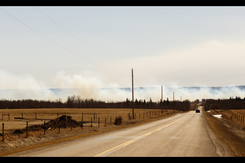 A wile fire rages between the Ghost Station Gas Bar and Wild Cat Gas Plant on Thursday (April 1). (Chelsea Kemp/The Cochrane Eagle)