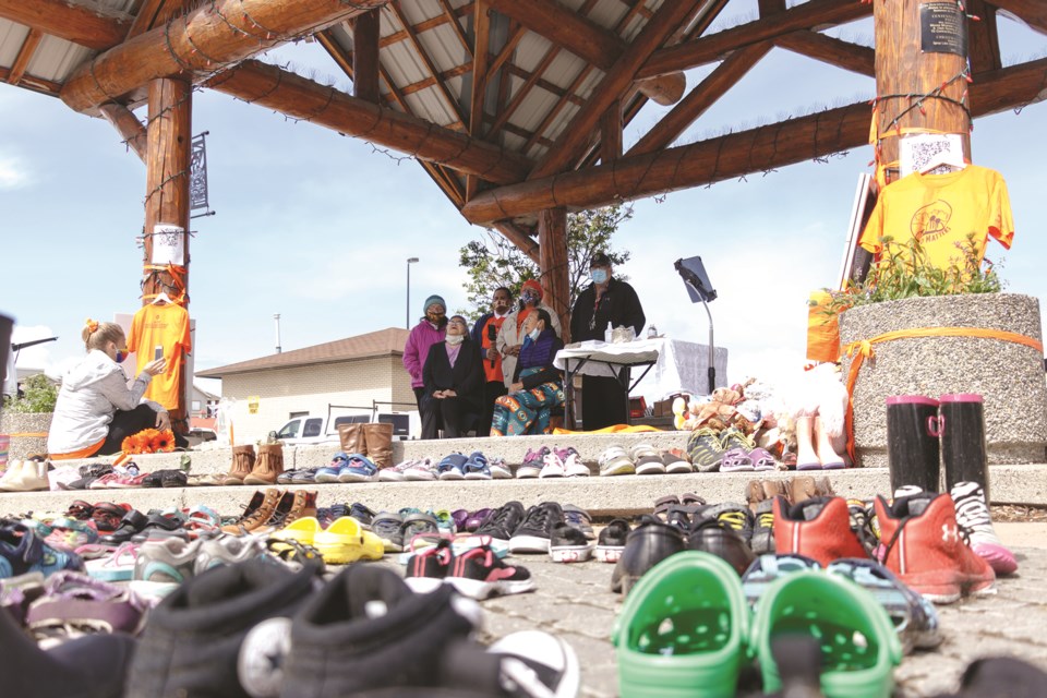 Stoney Nakoda First Nation members hold ceremony honouring the 215 children found at the Kamloops Residential School on Sunday (June 6) in Cochraneâs Historic Downtown. (Chelsea Kemp/The Cochrane Eagle)