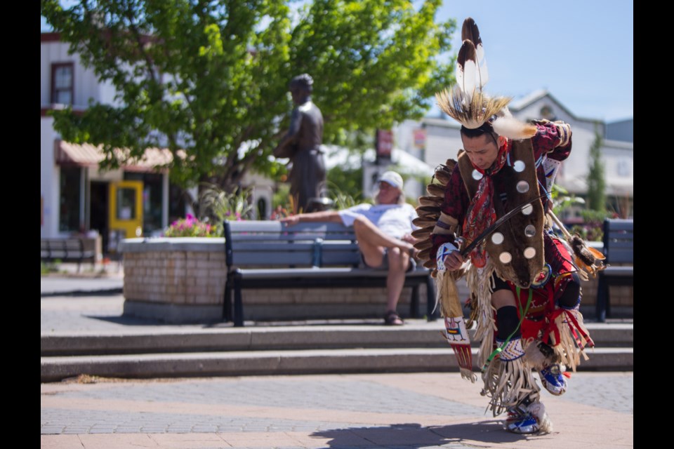 The AUMA funded Equity and Inclusion Committee Indigenous Cultural Advisor team members, led by Gloria Snow, Daryl Kootenay, Kyle Snow (Stoney Nakoda name Ohathi Thaba) and Ken Levi, perform songs and dances to record National Indigenous Peoples Day on Friday (June 18). (Chelsea Kemp/The Cochrane Eagle)