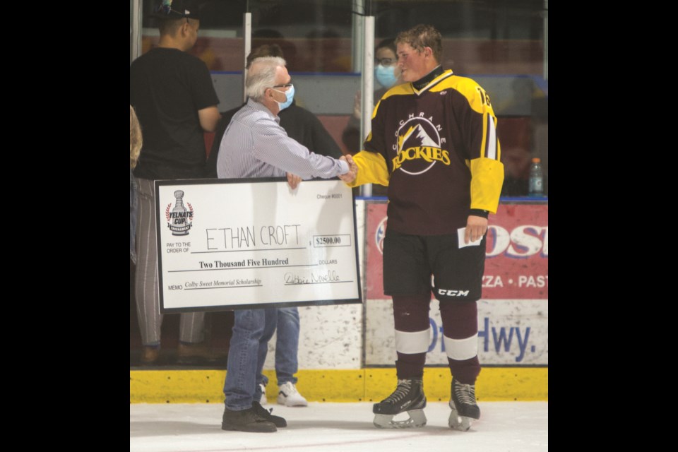 Cochrane Rockieâs U18 hockey player Ethan Croft receives the Colby Sweet Memorial Scholarship at the Tuesday (June 29) at the Cochrane Arena. (Chelsea Kemp/The Cochrane Eagle)