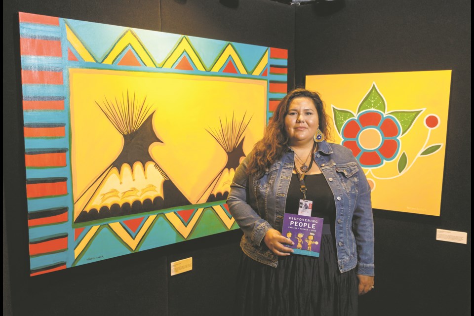 Cree artist Neepin Auger showcases her paintings at the Calgary Stampede Western Showcase on July 12. Photo by Chelsea Kemp/Great West Media