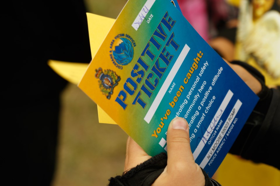 Cochrane RCMP and Cochrane and Area Victim Services team up to launch the Positive Ticket Campaign on Tuesday (July 20) at the Zero Gravity Skatepark. (Chelsea Kemp/The Cochrane Eagle)