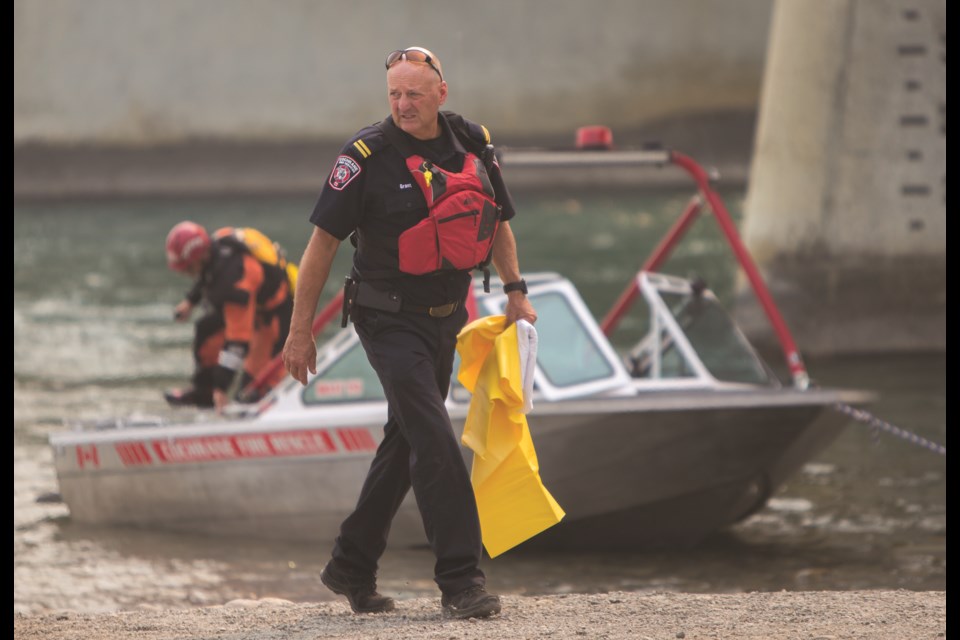 Cochrane Fire Services and Cochrane RCMP complete a search for a reported drowning on the Bow River on Thursday (July 29). (Chelsea  Kemp/The Cochrane Eagle)