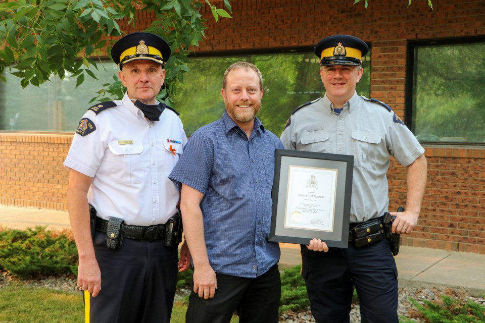 20210806 Robert Wambold receives plaque from RCMP JL 0040