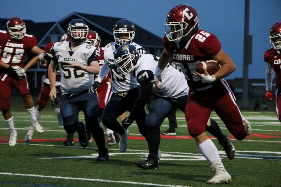 The Cochrane Cobras surge upfield against a match up with the Bow Valley Bobcats at Spray Lake Sawmills Legacy Field on Friday (Sept. 10). The final score was 54-1 for the Cobras. (Jessica Lee/The Cochrane Eagle)