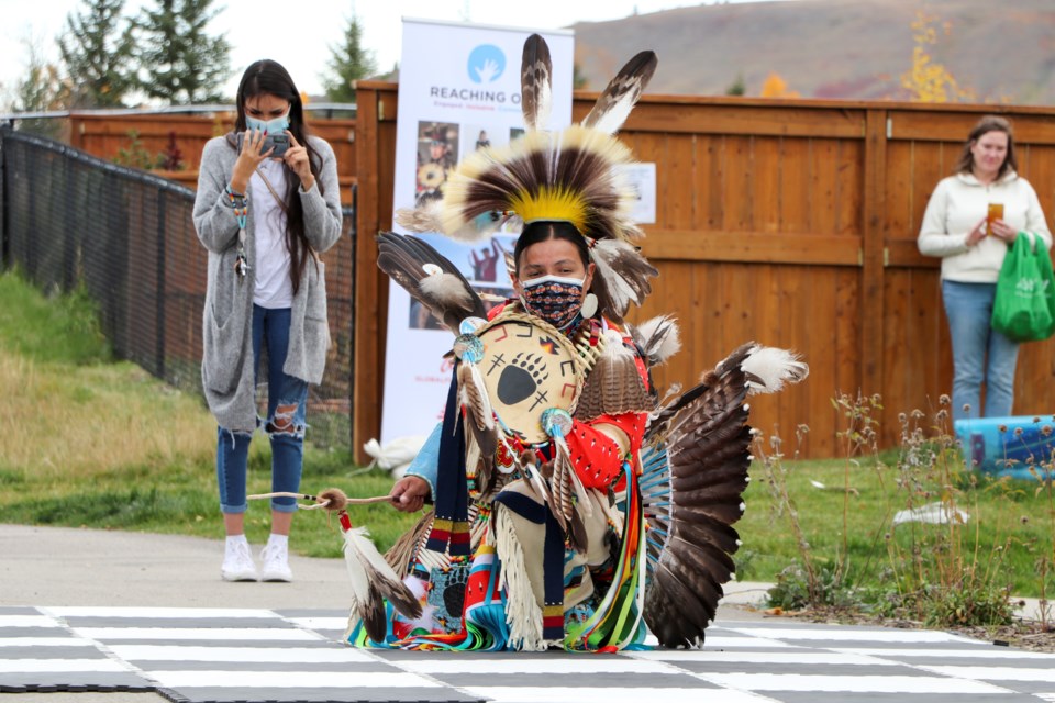 A dancer from the Blackfoot Crossing Dance Troupe performs at a pop-up event presented by GlobalFest for Alberta Culture Days in Precedence Park on Saturday (Sept. 25). (Jessica Lee/The Cochrane Eagle)