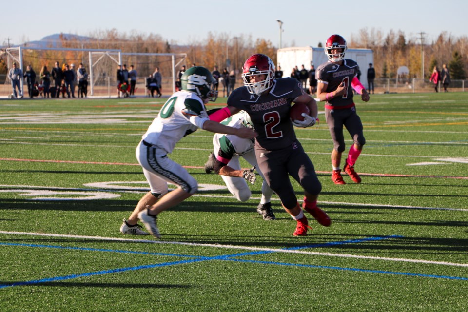 Cochrane Cobras running back Shaun Clauzie runs toward the Springbank Phoenix's end zone at Spray Lake Sawmills Legacy Field on Friday (Oct. 8). The Cobras beat the Phoenix 31-10. (Jessica Lee/The Cochrane Eagle)