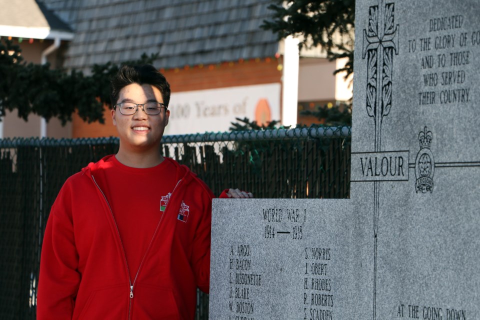 Matthew Lee, a Grade 12 student at Cochrane High School visits the cenotaph park Nov. 7, a day before his week-long trip to Ottawa as a recipient of The Vimy Foundation's prestigious Vimy Pilgrimage Award. (Jessica Lee/The Cochrane Eagle)