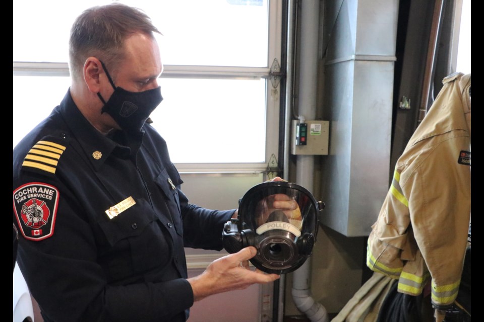 Cochrane Fire Services fire chief Shawn Polley shows off his current custom-fit mask. Firefighters will be fit for new masks next week in preparation to receive new self-contained breathing apparatuses around the new year. (Jessica Lee/The Cochrane Eagle)