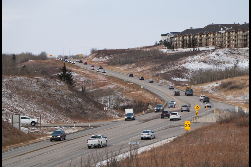 Traffic flows steadily on Highway 22 leading up to Sunset Boulevard around the evening rush hour Nov. 16. The 800-metre stretch of highway is set to receive an upgrade as an expansion of the Highway 1A/22 interchange project set to be picked up by the Province in spring 2022. (Jessica Lee/The Cochrane Eagle)