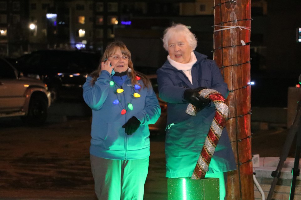 Cochrane Light Up president Stephanie Shelstad, left, and Cochrane Home Treasures chair Barb Primeau prepare for the countdown to unveil the light show Dec. 4. (Jessica Lee/The Cochrane Eagle)