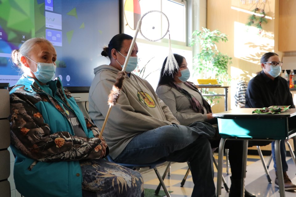 Stoney Nakoda elder Jackie Rider, left, Îyârhe Nakoda Youth Program outreach workers Earl Labelle and Danielle Lefthand, and Honouring Life Day Camp coordinator Gabriel Young sit in on a Grade 4 class at Nakoda Elementary School to provide lessons and answer questions about Stoney Nakoda traditions, language, and culture on Dec. 6. (Jessica Lee/The Cochrane Eagle)
