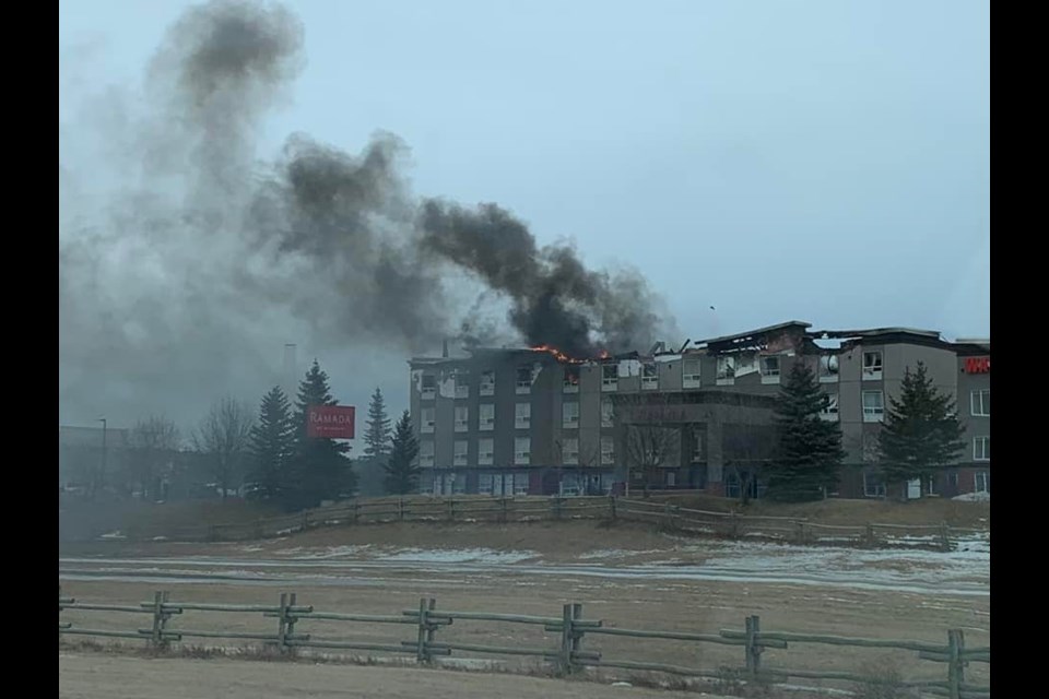 The Ramada Hotel is on fire again Feb. 8, as seen from near Highway 22. (Facebook Photo/Gill Cron)