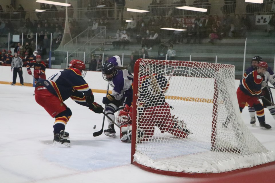 The Chaos fight to keep the puck out of their net in Game 1 of the AJFHL north final at the Cochrane Arena Feb. 25. The Lethbridge Eagles bested the team 4-1. (Jessica Lee/The Cochrane Eagle)