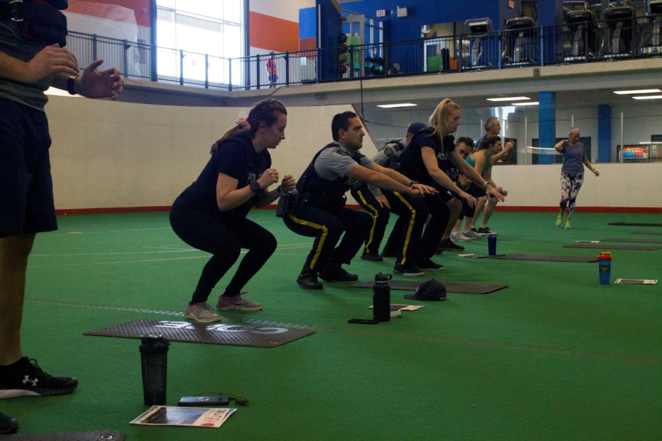 Members of the RCMP participating in the Sweat for a Vet event at Spray Lake Sawmills Family Sports Centre.