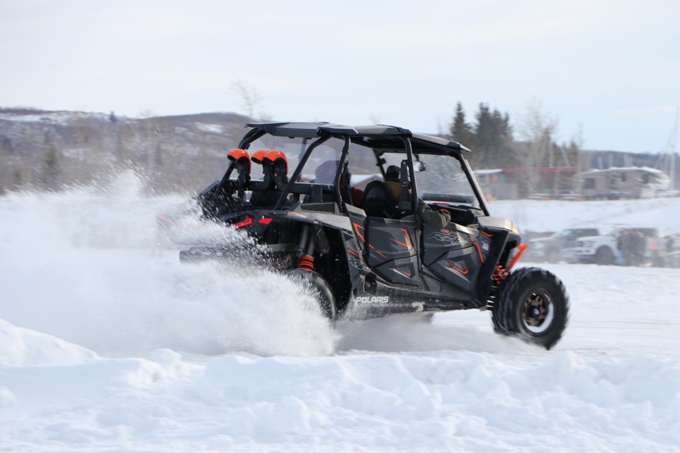 Hundreds of motorists drove side-by-sides, pick-up trucks, go-karts, sedans, quads, dirt bikes and SUVs on an ice track cleared at Ghost Lake Reservoir in the afternoon sun Jan. 9. (Jessica Lee/The Cochrane Eagle)